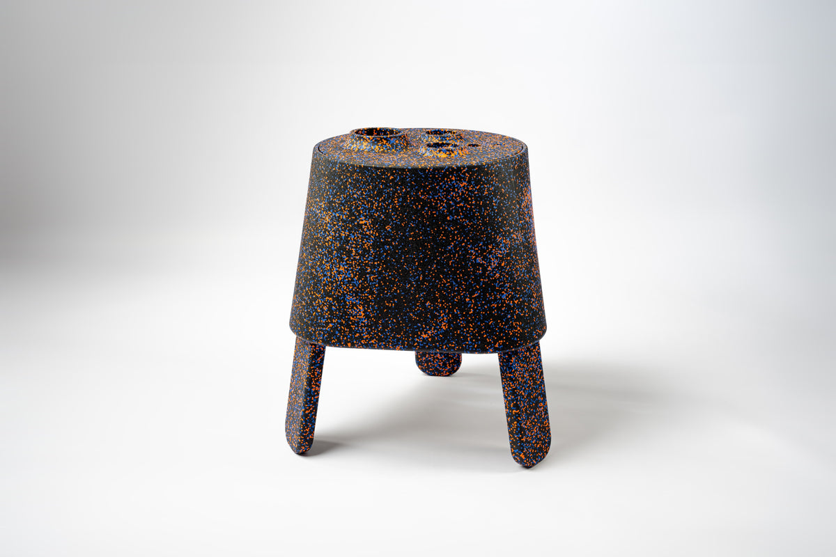 AYTO Black Mix – black multifunctional side table with orange speckles, made of EPP, on a white background