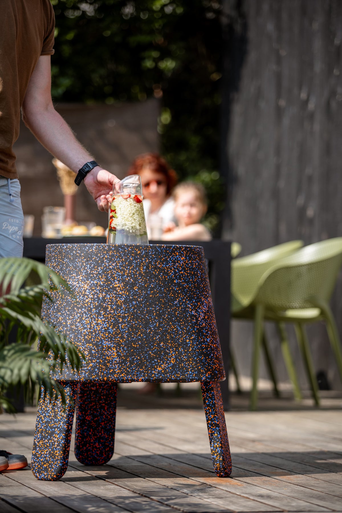 AYTO Black Mix used as a drinks table on a garden terrace